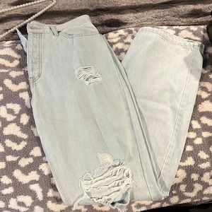 Ripped 90’s style wide leg distressed jeans. Brand new never worn.